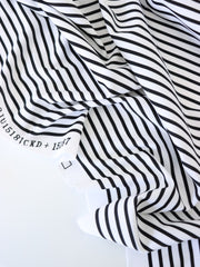 Load image into Gallery viewer, 1/4" Ivory & 1/8" Black Vertical Stripe Nylon Spandex Tricot | Designer Deadstock