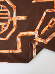 Load image into Gallery viewer, Rust Bamboo Lattice on Chocolate Nylon Spandex Tricot | Designer Deadstock