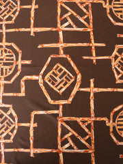 Load image into Gallery viewer, Rust Bamboo Lattice on Chocolate Nylon Spandex Tricot | Designer Deadstock