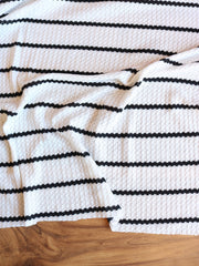 Load image into Gallery viewer, 4YD 20IN REMNANT; 1.5" Ivory & .5" Black Stripe Waffle Sweater Knit