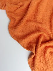 Load image into Gallery viewer, Orange Smocked Jersey Knit