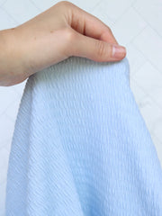 Load image into Gallery viewer, Pastel Blue Smocked Jersey Knit