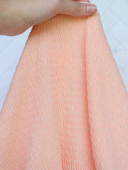 Load image into Gallery viewer, Pastel Peach Smocked Jersey Knit