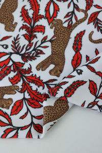 Leaping Leopards on White Nylon Spandex Tricot | Designer Deadstock