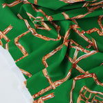 Load image into Gallery viewer, 1YD PRECUT; Orange Bamboo Lattice on Kelly Green Nylon Spandex Tricot | Designer Deadstock
