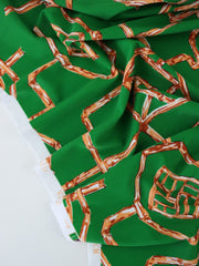 Load image into Gallery viewer, 1YD PRECUT; Orange Bamboo Lattice on Kelly Green Nylon Spandex Tricot | Designer Deadstock
