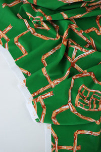 1YD PRECUT; Orange Bamboo Lattice on Kelly Green Nylon Spandex Tricot | Designer Deadstock