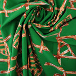 Load image into Gallery viewer, Orange Bamboo Lattice on Kelly Green Nylon Spandex Tricot | Designer Deadstock
