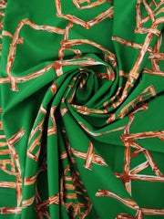 Load image into Gallery viewer, Orange Bamboo Lattice on Kelly Green Nylon Spandex Tricot | Designer Deadstock
