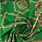 Load image into Gallery viewer, 1YD PRECUT; Orange Bamboo Lattice on Kelly Green Nylon Spandex Tricot | Designer Deadstock
