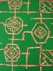 Load image into Gallery viewer, 1YD PRECUT; Orange Bamboo Lattice on Kelly Green Nylon Spandex Tricot | Designer Deadstock
