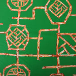 Load image into Gallery viewer, Orange Bamboo Lattice on Kelly Green Nylon Spandex Tricot | Designer Deadstock
