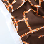 Load image into Gallery viewer, Rust Bamboo Lattice on Chocolate Nylon Spandex Tricot | Designer Deadstock
