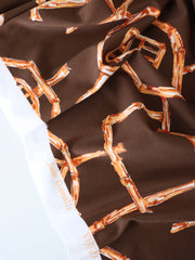 Load image into Gallery viewer, Rust Bamboo Lattice on Chocolate Nylon Spandex Tricot | Designer Deadstock
