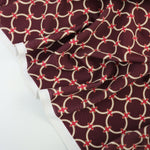 Load image into Gallery viewer, White Rings on Maroon Nylon Spandex Tricot | Designer Deadstock
