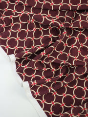 Load image into Gallery viewer, White Rings on Maroon Nylon Spandex Tricot | Designer Deadstock
