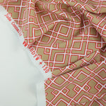 Load image into Gallery viewer, Red Outline Geometric on Tan Nylon Spandex Tricot | Designer Deadstock
