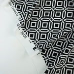 Load image into Gallery viewer, Intertwined on Black Nylon Spandex Tricot | Designer Deadstock

