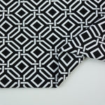 Load image into Gallery viewer, Intertwined on Black Nylon Spandex Tricot | Designer Deadstock
