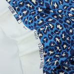 Load image into Gallery viewer, Cheetah on Blue Matte Nylon Spandex Tricot | Designer Deadstock
