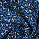 Load image into Gallery viewer, Cheetah on Blue Matte Nylon Spandex Tricot | Designer Deadstock
