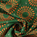 Load image into Gallery viewer, Orange Geometric Circles on Emerald Cotton Lawn
