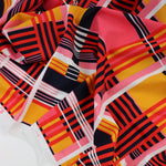 Load image into Gallery viewer, 1YD PRECUT; Mango/Pink/Red Plaid Nylon Spandex Tricot | Designer Deadstock
