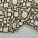 Load image into Gallery viewer, Geo on Ivory Nylon Spandex Tricot | Designer Deadstock
