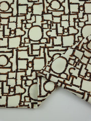 Load image into Gallery viewer, Geo on Ivory Nylon Spandex Tricot | Designer Deadstock
