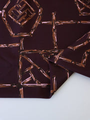 Load image into Gallery viewer, Bamboo Lattice on Dark Maroon Nylon Spandex Tricot | Designer Deadstock
