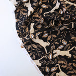 Load image into Gallery viewer, Leaping Leopards on Black Nylon Spandex Tricot | Designer Deadstock
