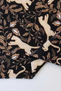 Leaping Leopards on Black Nylon Spandex Tricot | Designer Deadstock