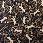 Load image into Gallery viewer, Leaping Leopards on Black Nylon Spandex Tricot | Designer Deadstock
