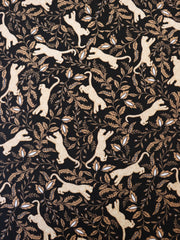 Load image into Gallery viewer, Leaping Leopards on Black Nylon Spandex Tricot | Designer Deadstock
