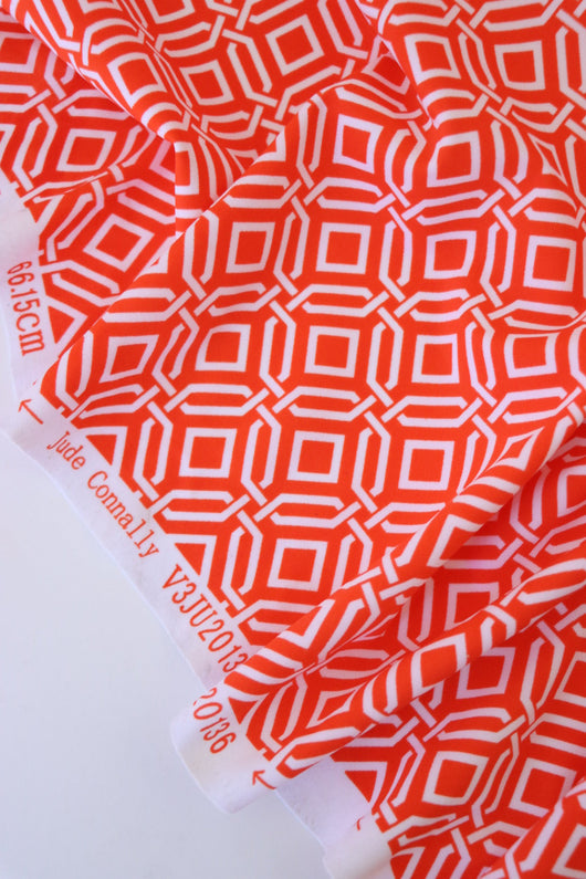1YD PRECUT; Intertwined on Orange Nylon Spandex Tricot | Designer Deadstock