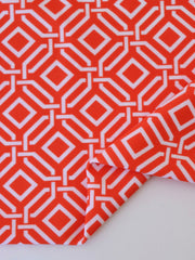 Load image into Gallery viewer, 1YD PRECUT; Intertwined on Orange Nylon Spandex Tricot | Designer Deadstock

