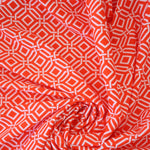 Load image into Gallery viewer, 1YD PRECUT; Intertwined on Orange Nylon Spandex Tricot | Designer Deadstock
