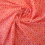Load image into Gallery viewer, Intertwined on Orange Nylon Spandex Tricot | Designer Deadstock
