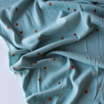 Load image into Gallery viewer, Tossed Hearts on Chambray Brushed Sweater Knit
