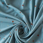 Load image into Gallery viewer, Tossed Hearts on Chambray Brushed Sweater Knit
