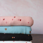 Load image into Gallery viewer, Tossed Hearts on Black Yummy 4x2 Rib Knit
