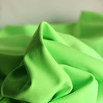 Load image into Gallery viewer, Neon Lime QUAD Performance Jersey Knit | By The Half Yard
