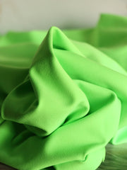 Load image into Gallery viewer, Neon Lime QUAD Performance Jersey Knit | By The Half Yard
