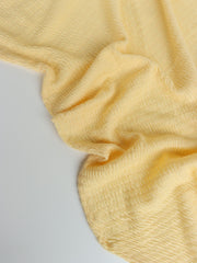 Load image into Gallery viewer, 1YD 19IN REMNANT; Pastel Yellow Smocked Jersey Knit