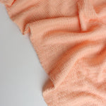 Load image into Gallery viewer, Pastel Peach Smocked Jersey Knit
