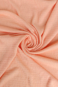 Pastel Peach Smocked Jersey Knit