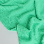 Load image into Gallery viewer, Bright Mint Smocked Jersey Knit
