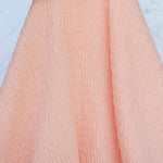 Load image into Gallery viewer, Pastel Peach Smocked Jersey Knit
