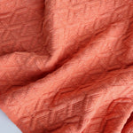 Load image into Gallery viewer, Tangerine Interwoven Squares Quilted Knit | By The Half Yard
